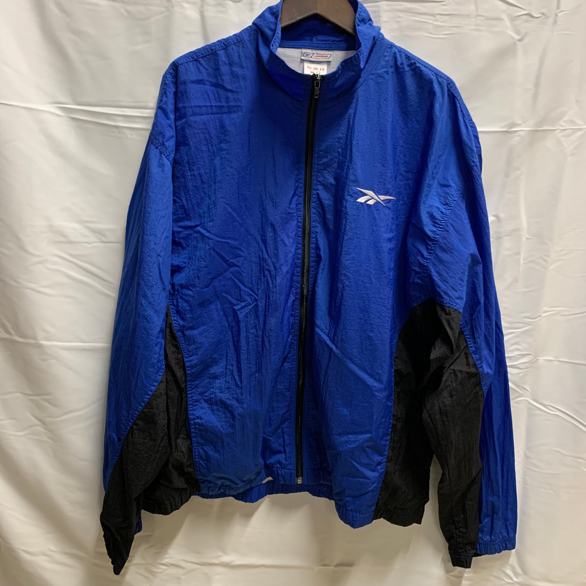 【中古】【古着】Reebok ロゴ ナイロンプルオーバージャケット ブルー XLサイズ