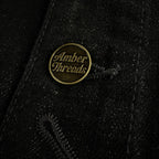 アパレルブランドAmber Threads(アンバースレッズ)のカバーオール ブラックデニム、3シーズン着まわせる万能アウター。正面ボタンのアップ